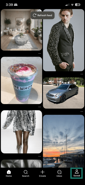 iOS Pinterest app home screen with the Saved button highlighted.